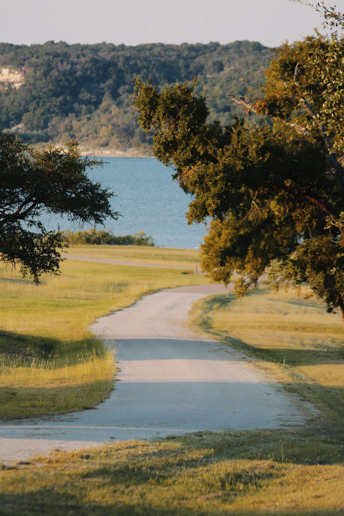 Lakeside walking trail through Hill Country oaks